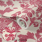 Roll of pink floral wallpaper with close-up details on a beige background