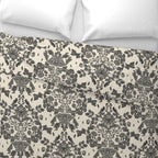 Floral and damask patterned bedding and fabric with a white background