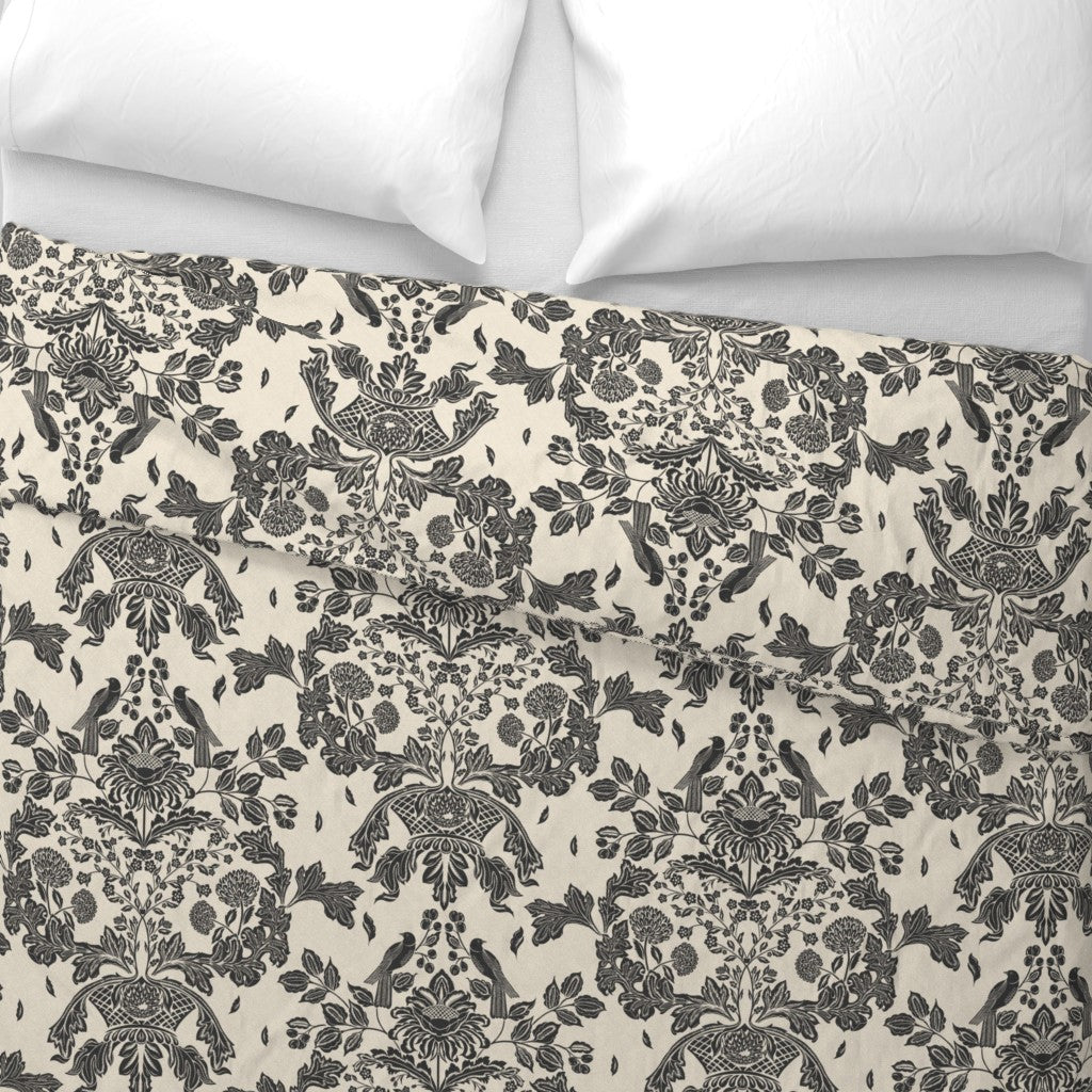 Floral and damask patterned bedding and fabric with a white background