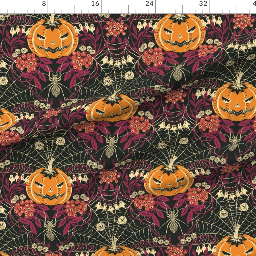 Halloween-themed fabric with pumpkins, spiders, and webs on a dark background.
